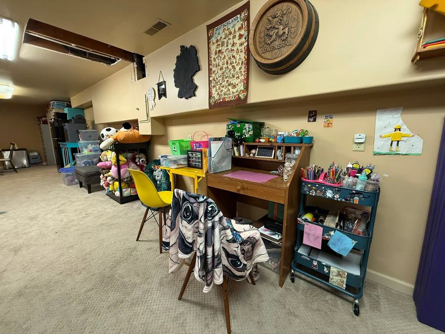 The same corner after: the desk clear, the shelves ordered, the floor empty.